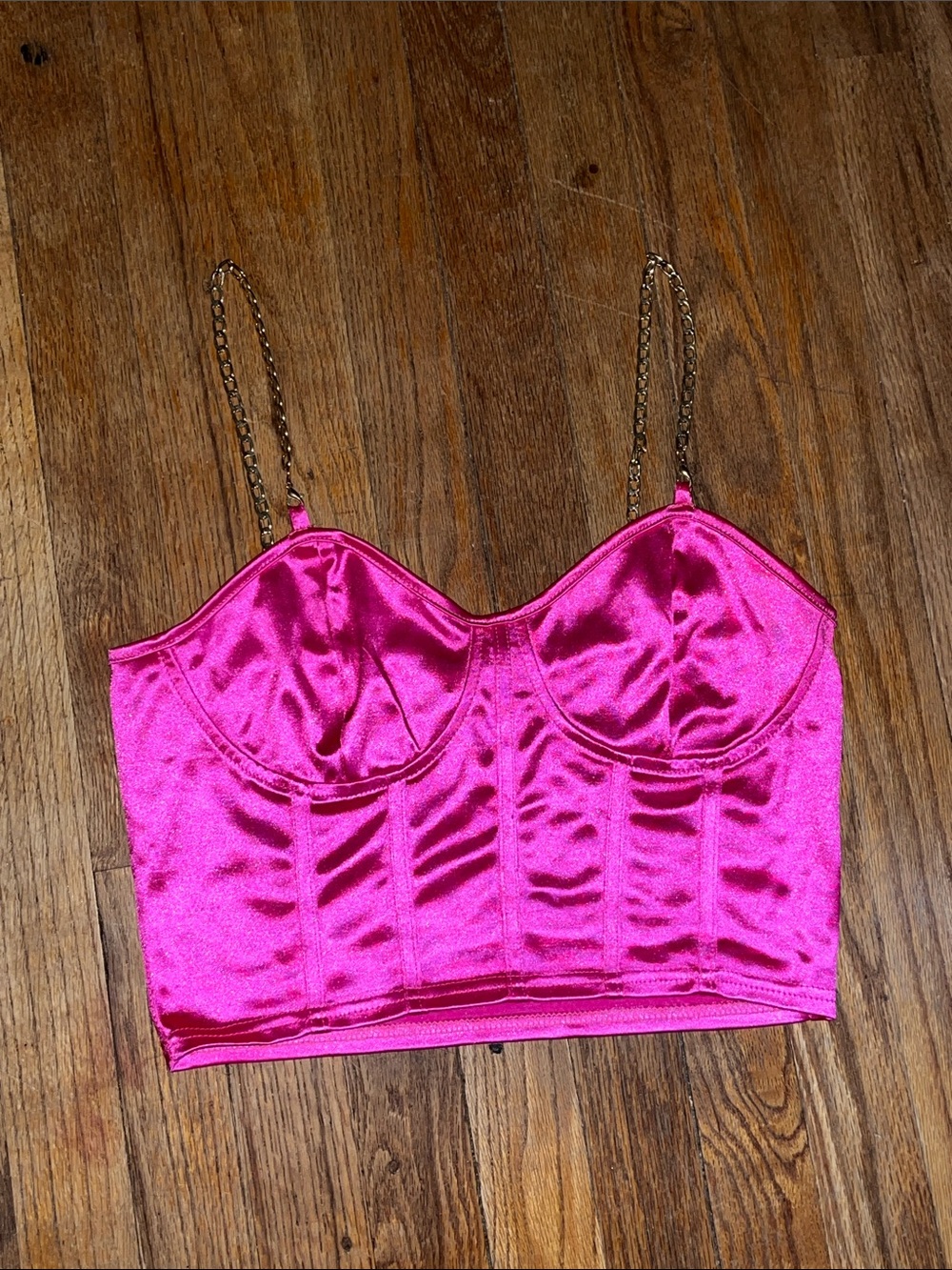 Pink satin corset with gold colored chain straps